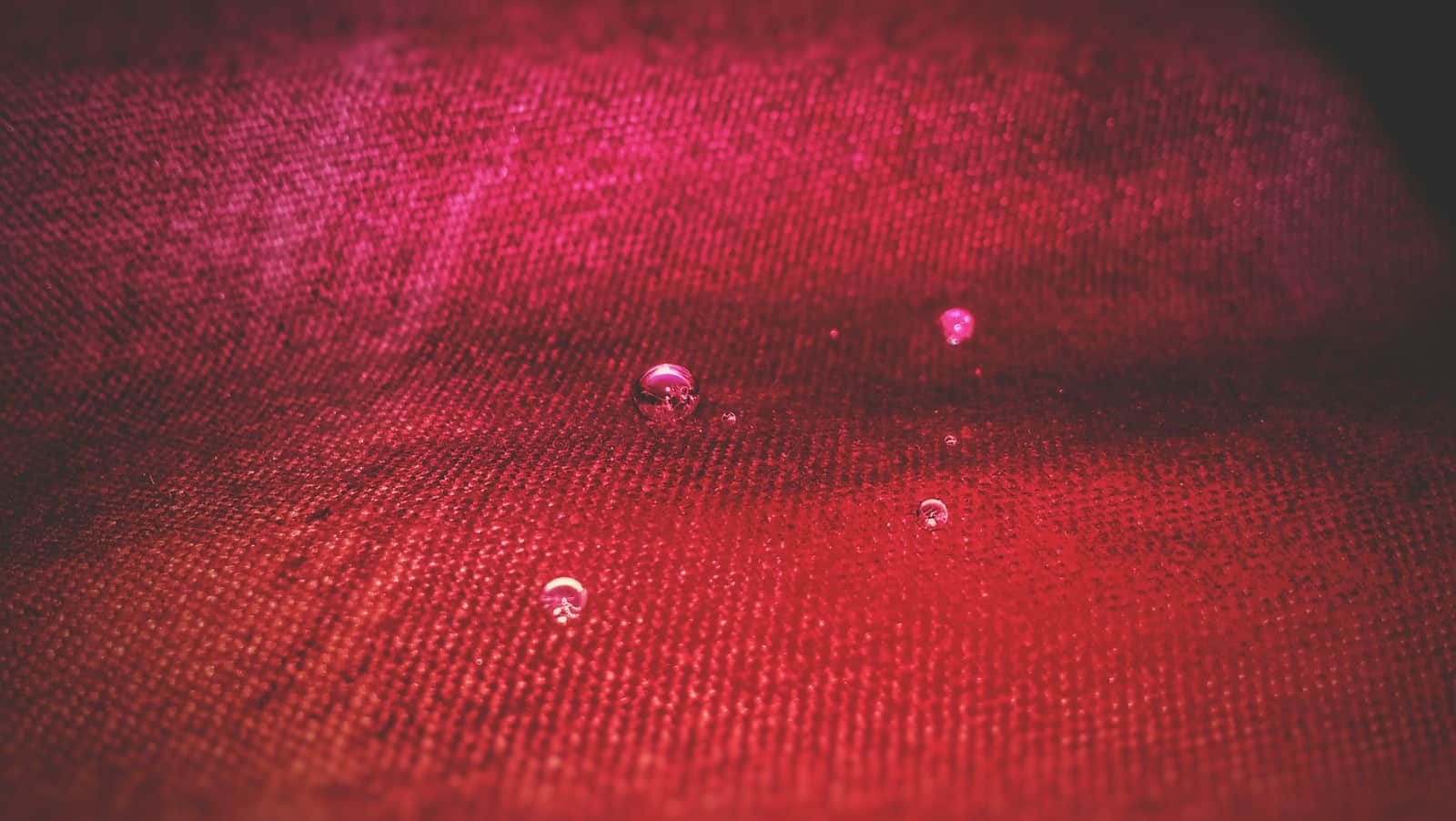 A water droplet mark on fabric, close up
