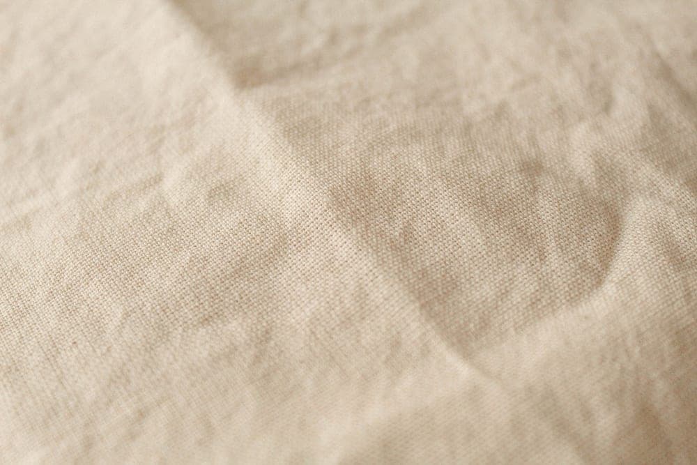 Close-up of natural linen weave in daylight