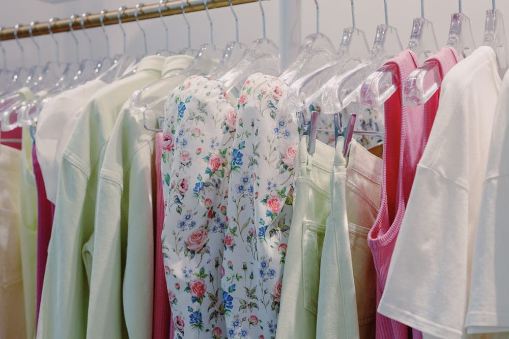 A polyester dress hanging on a rail