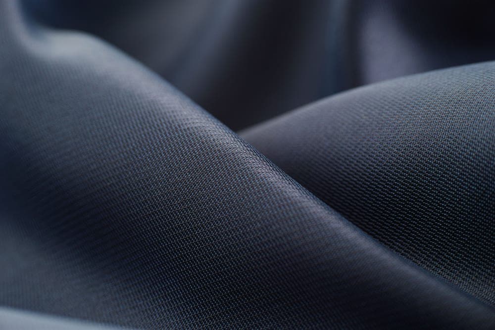 Satin fabric catching light across its surface