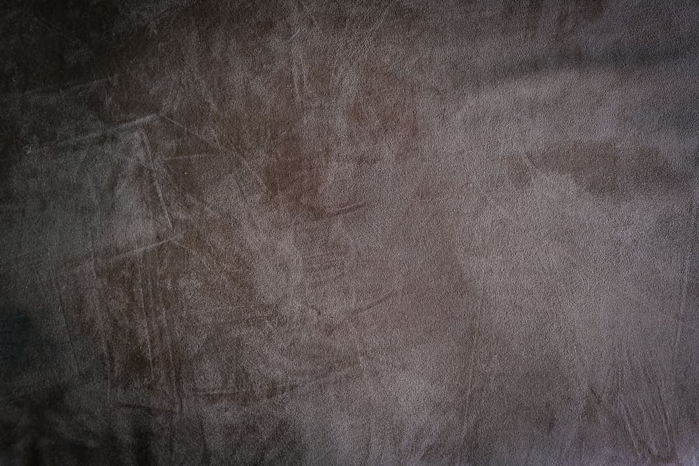 Close-up of brown suede showing its raised nap