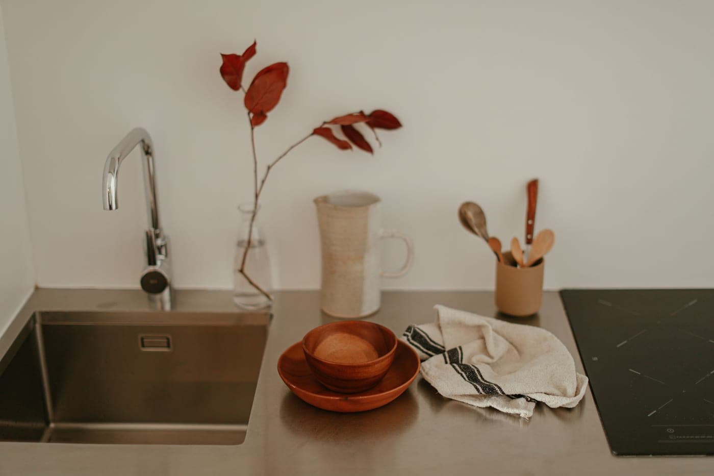 A clean home appliance and a jug of water on a kitchen counter