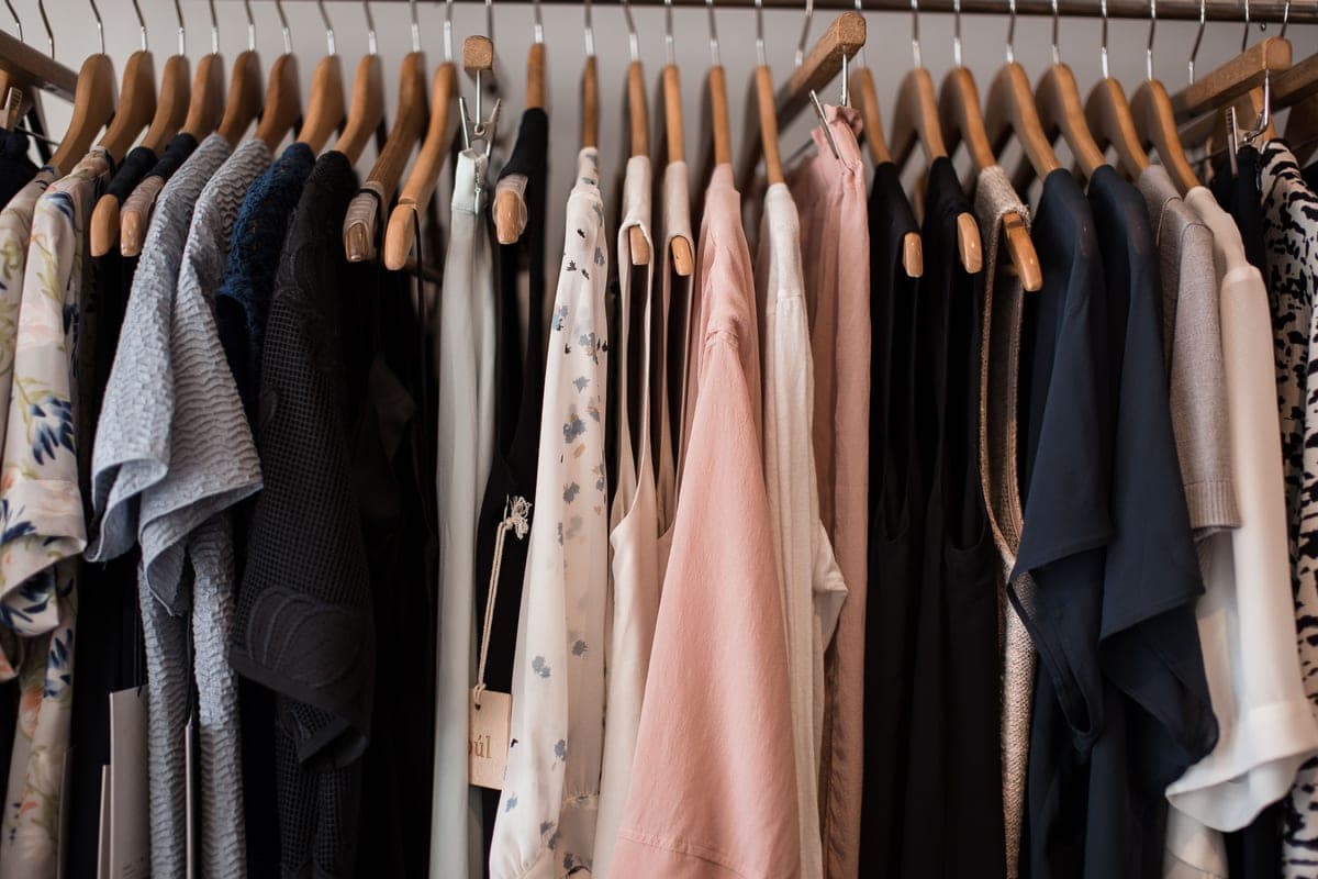 Garments on a rail in a dry cleaning shop