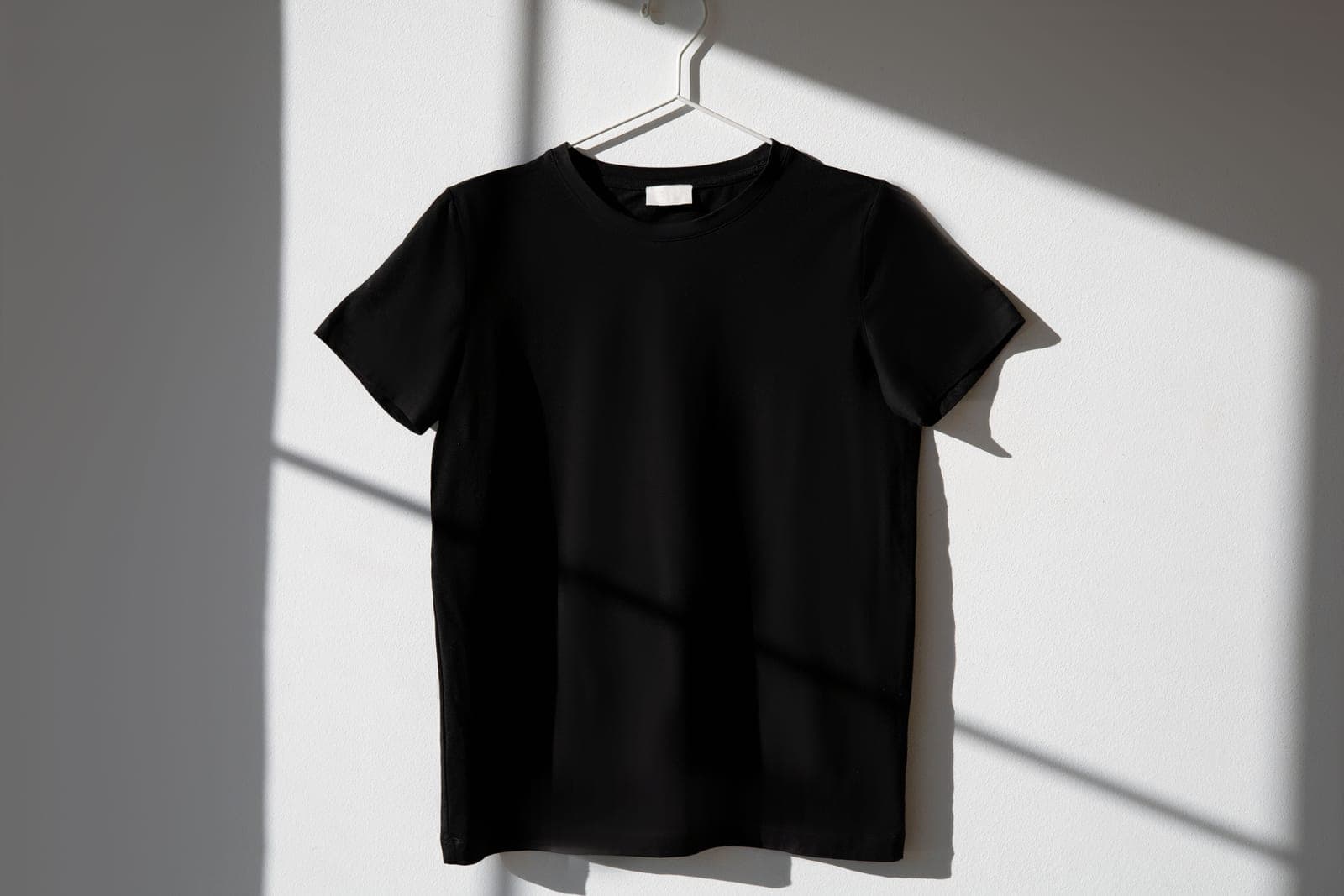 A shirt on a hanger with no appliance cord in sight