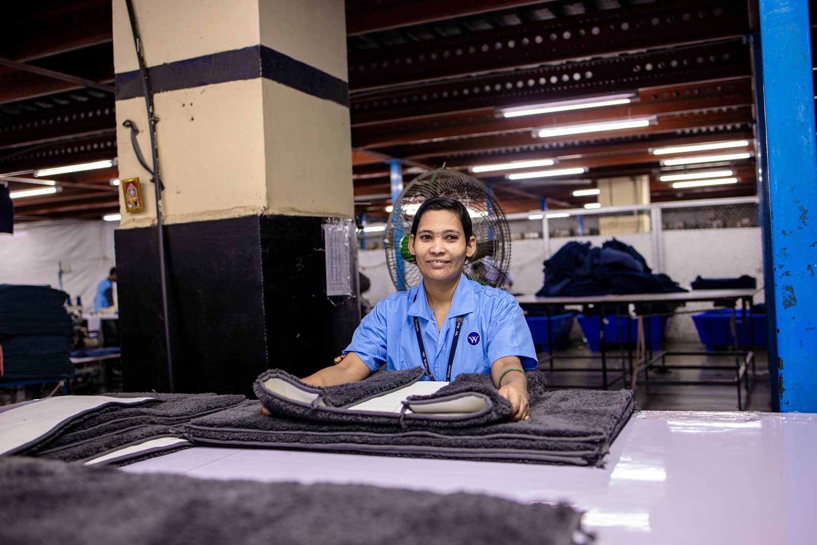 Pressed uniform shirts hanging on a rail