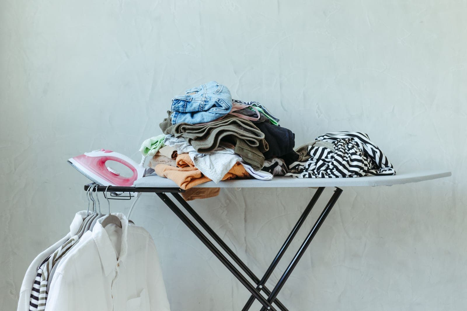 A pressed shirt hanging in a bright room